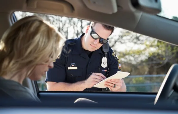 A policeman gathers information.